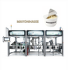 Automatic mayonnaise cup filling and sealing machine for portion cups, condiment cups, and salad dressing packaging. Features servo-driven filling, precise sealing, hygienic stainless steel constructi